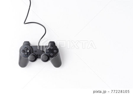 Video game controller isolated on white background with copyspace. Computer player concept. Top view Video game controller isolated on white background with copyspace. Computer player concept. Top view 77228105