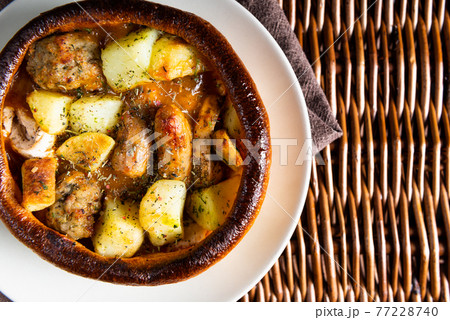 Open Pie with Potatoes and different kinds of meat 77228740