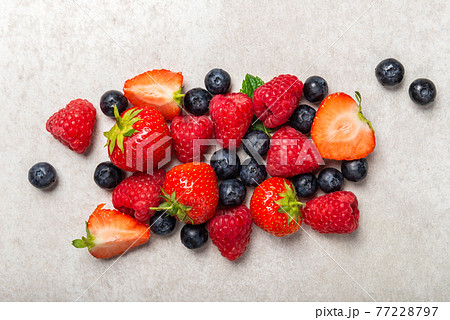Fresh summer berries such as blueberries, strawberries, raspberries 77228797