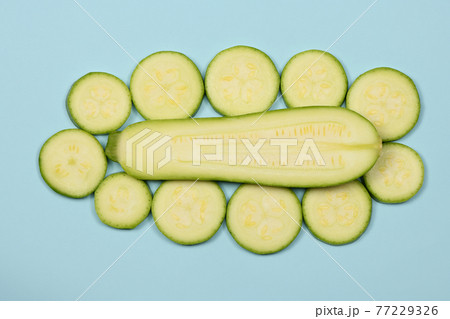 Perfectly retouched zucchini isolated on blue. Perfectly retouched zucchini isolated on blue. 77229326