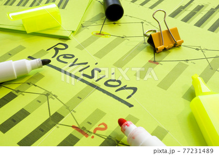 Financial charts with Revision mark about revising, auditing or accounting. Financial charts with Revision mark about revising, auditing or accounting. 77231489