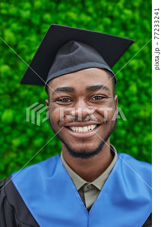 Smiling man wearing graduation hat Smiling man wearing graduation hat 77233241