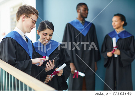 University graduates indoors University graduates indoors 77233349