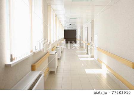 Solar bright light shining from windows of hospital corridor Solar bright light shining from windows of hospital corridor 77233910