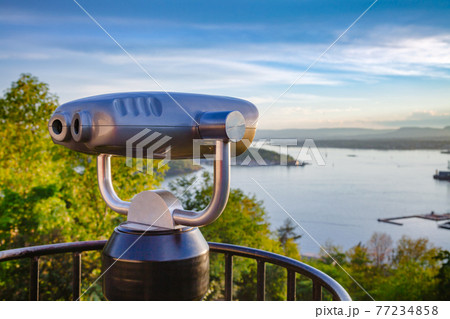 Tourist telescope over Oslo cityscape at sunset Norway Tourist telescope over Oslo cityscape at sunset Norway 77234858