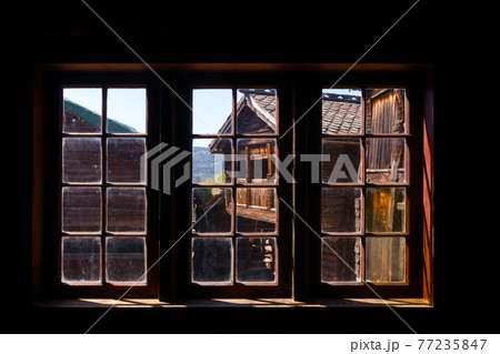 Old traditional Norwegian wooden house window Maihaugen Folks museum Lillehammer Oppland Norway Scandinavia 77235847