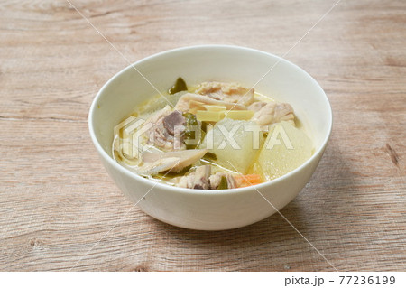 spicy boiled winter melon with chicken bone tom yum soup in bowl spicy boiled winter melon with chicken bone tom yum soup in bowl 77236199