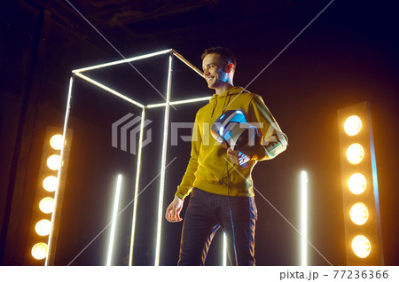 Man plays the game using virtual reality headset 77236366