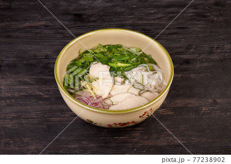 soup with chicken meat, rice noodles, dill, parsley, green onions, served with ginger soup with chicken meat, rice noodles, dill, parsley, green onions, served with ginger 77238902
