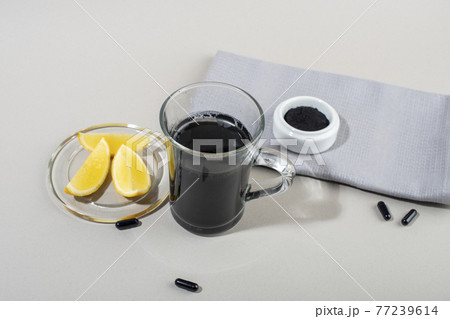 Detox drink with activated charcoal. Detox drink with activated charcoal. 77239614