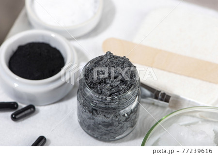 Ingredients for a homemade charcoal facial mask. Ingredients for a homemade charcoal facial mask. 77239616