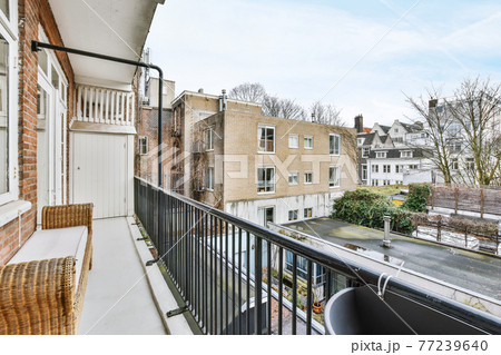 Balcony on brick apartment building Balcony on brick apartment building 77239640