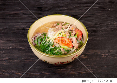 meat soup with tomatoes, greens, noodles and chopped onions meat soup with tomatoes, greens, noodles and chopped onions 77240101