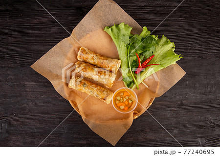 roulettes of pork, mushrooms, chicken fillet, fried in rice paper, greens 77240695