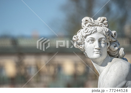 Old statue of a sensual naked Renaissance Era woman in the park of Potsdam, Germany, details, closeup 77244528