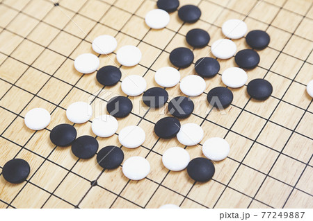 Board Game Go Table Japanese, Chinese, Asian traditional strategy game. Board Game Go Table Japanese, Chinese, Asian traditional strategy game. 77249887