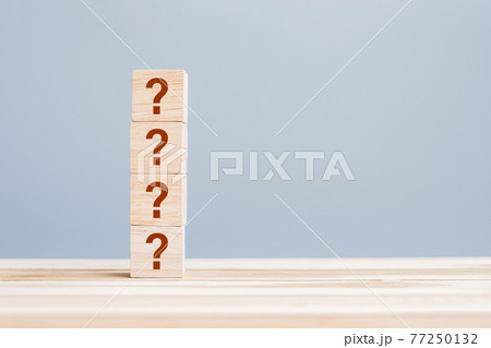 Questions Mark ( ? ) on wooden cube block on table background. FAQ( frequency asked questions), Answer, Q and A, Information, Communication and interrogation Concepts 77250132