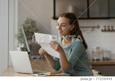 Smiling female employee get pleasant postal message 77250443