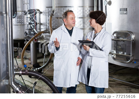 Man and woman check of equipment Man and woman check of equipment 77255616