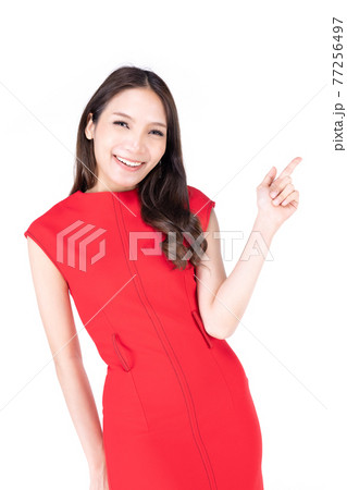 Portrait beautiful woman in a red dress Showing a happy expression and point up on a white background 77256497