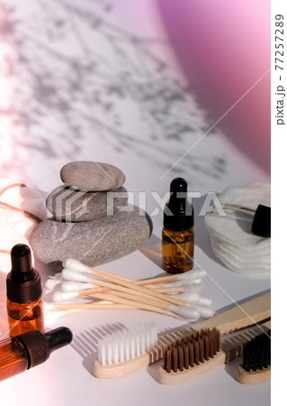 Reusable and recycable bathroom accessories on white background. Trendy shadows. Zero waste concept. Natural cosmetics and eco living concept Reusable and recycable bathroom accessories on white background. Trendy shadows. Zero waste concept. Natural cosmetics and eco living concept 77257289