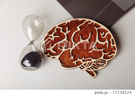 Wooden human brain and hourglass Wooden human brain and hourglass 77258524