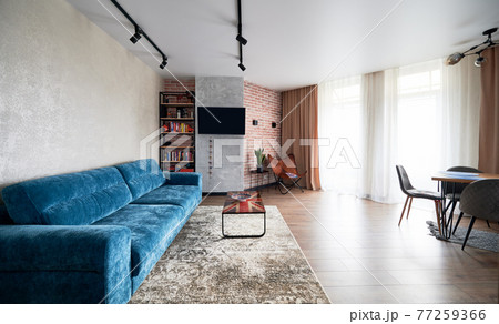 Bright spacious living room in functional style. 77259366