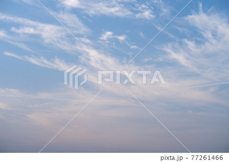 White clouds against blue sky in vertical background and copy space  77261466