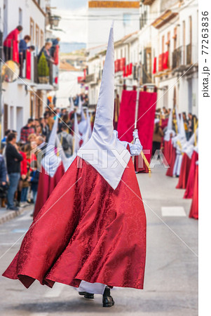 People participating in the Holy Week procession in a Spanish city during Easter People participating in the Holy Week procession in a Spanish city during Easter 77263836