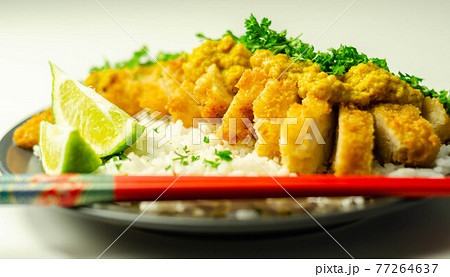 Crispy chicken perked up with an aromatic katsu curry sauce and fragrant fluffy rice Crispy chicken perked up with an aromatic katsu curry sauce and fragrant fluffy rice 77264637
