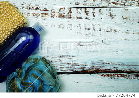 Shower accessories bath items shower gel, sponge, Hair Brush, fibre scrub on wooden background 77264774