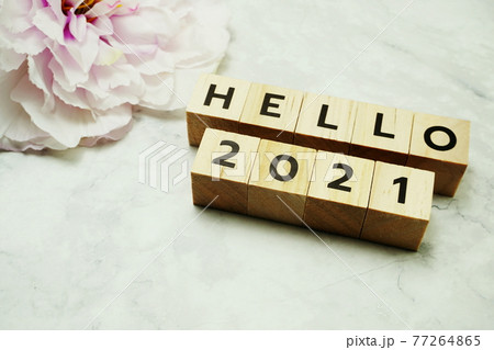 Hello 2021 alphabet letters on marble background Hello 2021 alphabet letters on marble background 77264865
