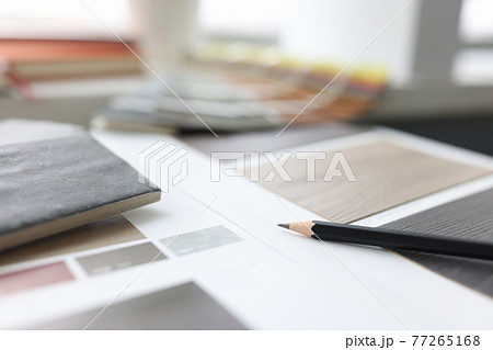 Catalog with samples of wood flooring is on table Catalog with samples of wood flooring is on table 77265168