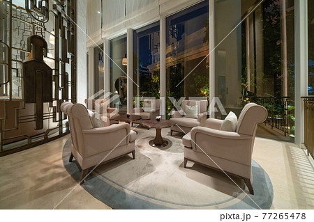 Inside of modern hotel lobby, entrance and reception, waiting area with urban city view of outdoor, indoor. Inside of modern hotel lobby, entrance and reception, waiting area with urban city view of outdoor, indoor. 77265478