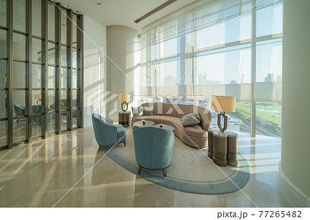 Inside of modern hotel lobby, entrance and reception, waiting area with urban city view of outdoor, indoor. Inside of modern hotel lobby, entrance and reception, waiting area with urban city view of outdoor, indoor. 77265482