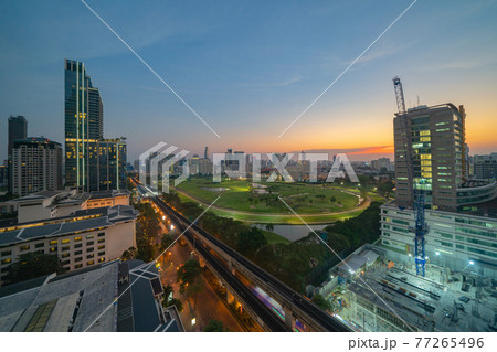 Aerial view of Bangkok Sports Club, golf field in Ratchadamri district, Bangkok Downtown Skyline. Thailand. Financial district in smart urban city in Asia. Skyscraper and high-rise buildings 77265496