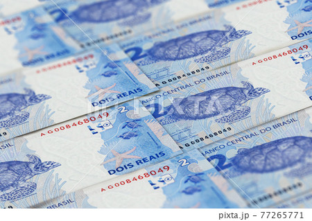BRL. Closeup Brazilian real banknotes background BRL. Closeup Brazilian real banknotes background 77265771