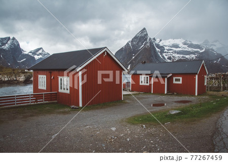 Norway rorbu houses and mountains rocks over fjord landscape scandinavian travel view Lofoten islands Norway rorbu houses and mountains rocks over fjord landscape scandinavian travel view Lofoten islands 77267459