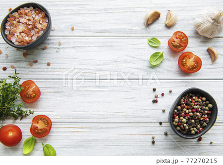 Tomato, basil and pepper with garlic on white wooden background 77270215