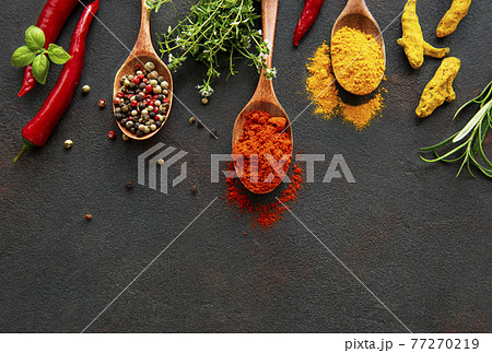 Various spices spoons on stone table. Top view with copy space 77270219