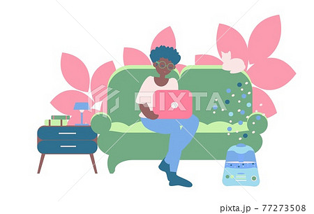 Freelancer working at home Young african american women seat on sofa with note book and humidifier near nightstand Freelancer working at home Young african american women seat on sofa with note book and humidifier near nightstand 77273508