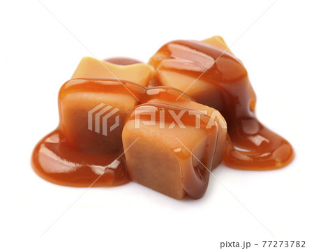 Caramel candy with caramel topping on white backgrounds Caramel candy with caramel topping on white backgrounds 77273782