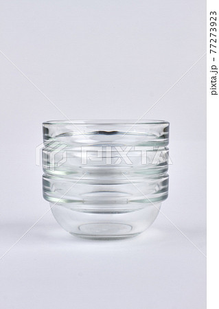 Set of transparent glass bowls. Isolated on white background. Set of transparent glass bowls. Isolated on white background. 77273923