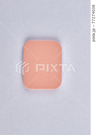 Top view of face powder sponge isolated on white background. Top view of face powder sponge isolated on white background. 77274036