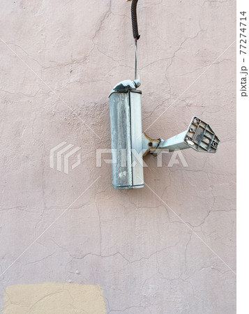 The surveillance camera came off and hangs on wire The surveillance camera came off and hangs on wire 77274714