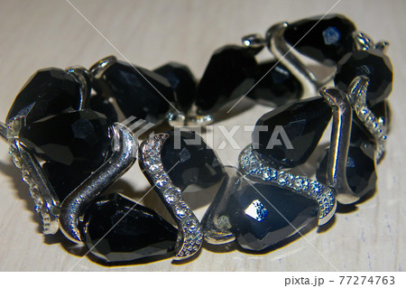 Black female bracelet of semi-precious stones.Women's jewelry on hand Black female bracelet of semi-precious stones.Women's jewelry on hand 77274763