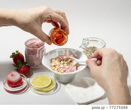 Woman hands making homemade cosmetics. 77275088