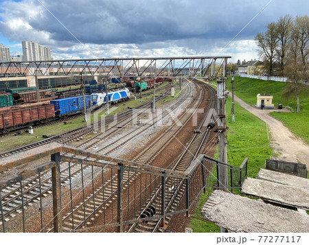 Railway wagons with cargo of metal and grain in port of Odessa. trains are waiting in line for loading at cargo terminal. most economical logistics solutions for rail transport Railway wagons with cargo of metal and grain in port of Odessa. trains are waiting in line for loading at cargo terminal. most economical logistics solutions for rail transport 77277117