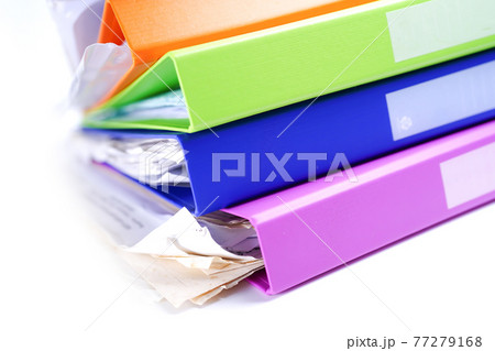File Folder Binder stack of multi color on table in office. File Folder Binder stack of multi color on table in office. 77279168