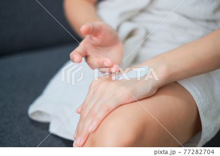 Woman applying natural cream, Woman moisturizing her hand with cosmetic cream, Spa and Manicure concept. 77282704
